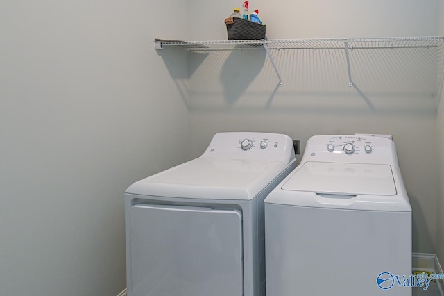 washroom with washer and clothes dryer