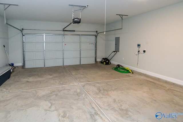 garage with a garage door opener and electric panel