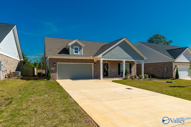 view of front of property with a garage and a front yard