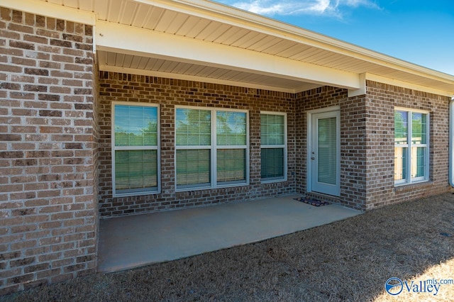 property entrance featuring a patio area