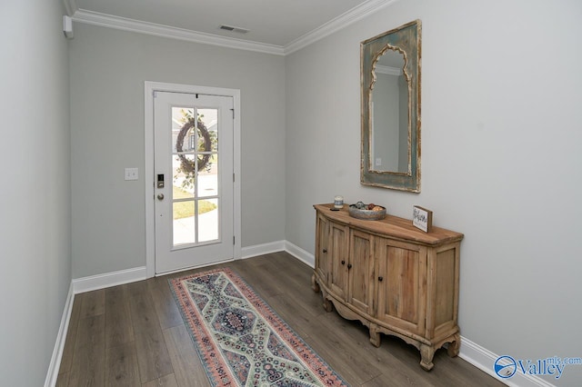 doorway featuring dark wood-type flooring and crown molding