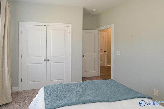 carpeted bedroom featuring a closet