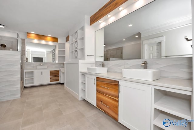 bathroom featuring tasteful backsplash, vanity, and tile patterned flooring