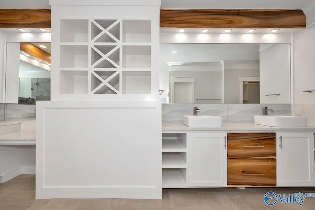 bathroom with tasteful backsplash and vanity