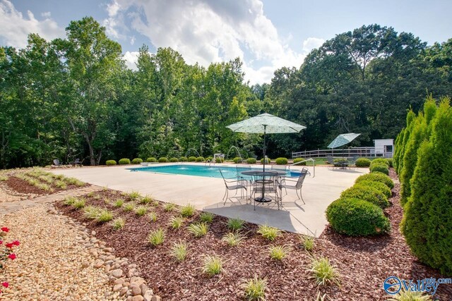 community pool with a patio