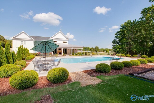 pool with a patio