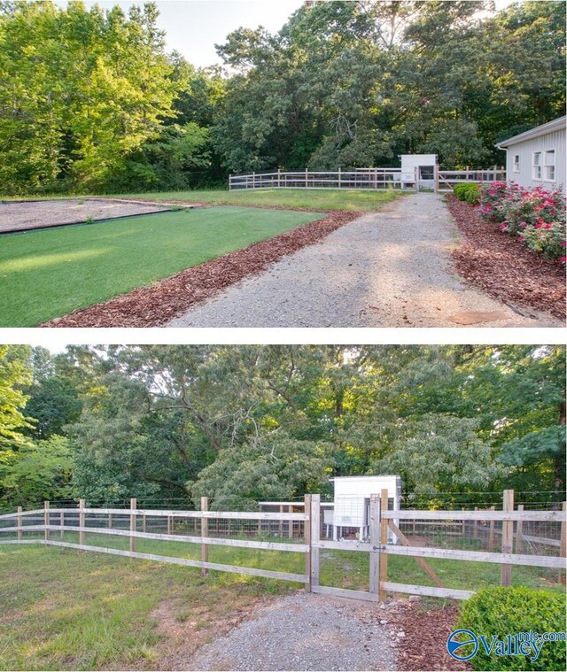 surrounding community featuring a gate, fence, and a yard
