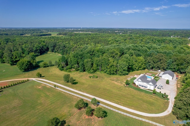 bird's eye view featuring a rural view and a wooded view