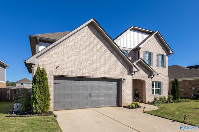 front of property featuring a front yard and a garage