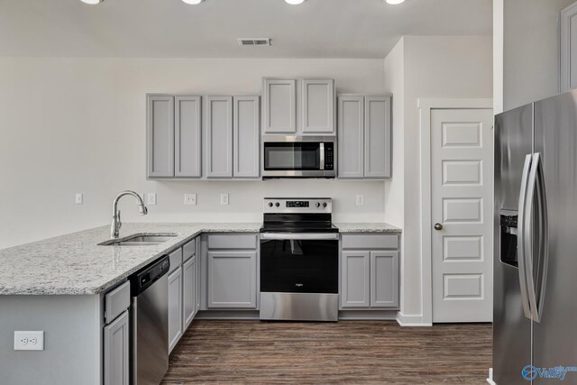 6208 Taramore Ln, Huntsville, AL 35806 - kitchen featuring stainless steel appliances, a peninsula, a sink, visible vents, and gray cabinets