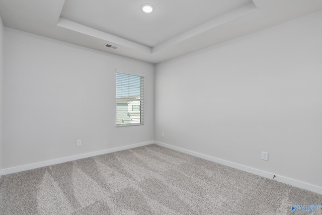 6208 Taramore Ln, Huntsville, AL 35806 - unfurnished room with a tray ceiling, baseboards, visible vents, and carpet