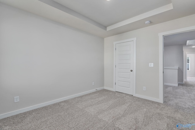 6208 Taramore Ln, Huntsville, AL 35806 - unfurnished bedroom with a tray ceiling, carpet flooring, attic access, and baseboards