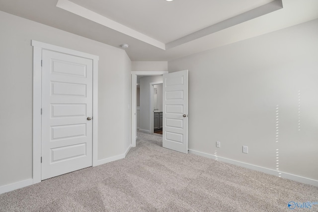6208 Taramore Ln, Huntsville, AL 35806 - unfurnished bedroom with carpet floors, a tray ceiling, and baseboards