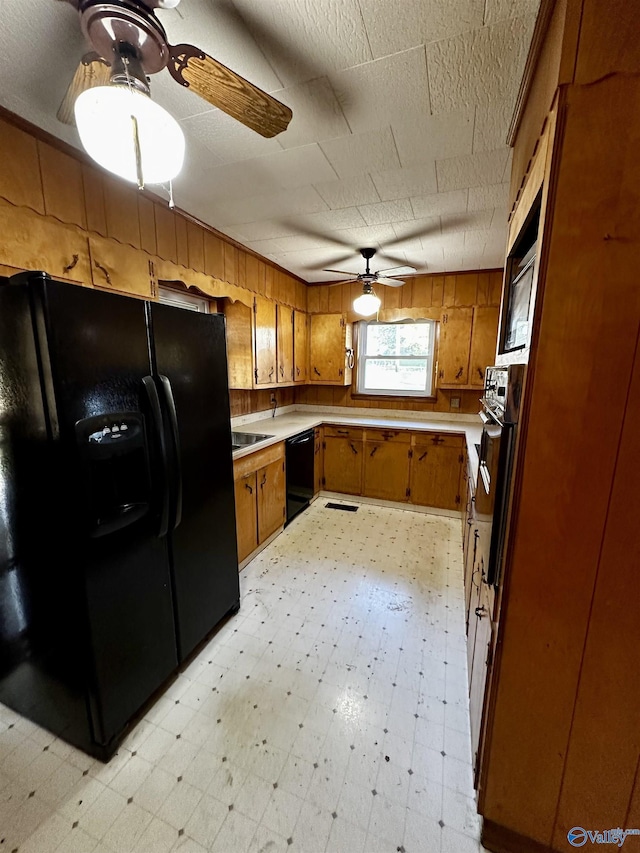 kitchen featuring ceiling fan and black appliances