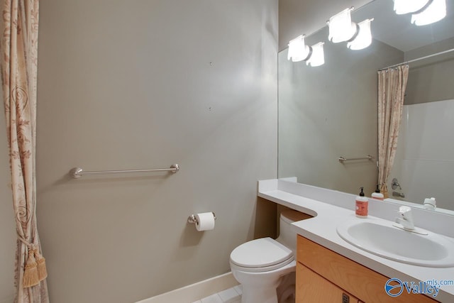 bathroom with curtained shower, toilet, and vanity