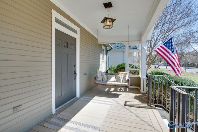 wooden terrace featuring a porch