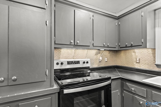 839 Bow Range Rd, Guntersville, AL 35976 - kitchen with stainless steel range with electric stovetop, gray cabinetry, dark countertops, and decorative backsplash