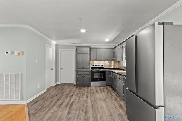839 Bow Range Rd, Guntersville, AL 35976 - kitchen featuring light wood-style floors, crown molding, visible vents, gray cabinets, and appliances with stainless steel finishes