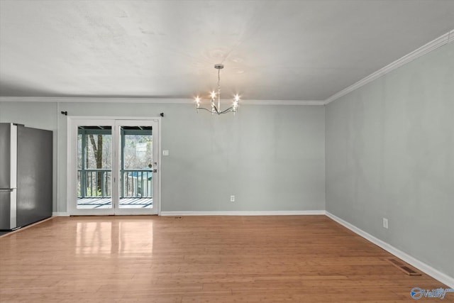 839 Bow Range Rd, Guntersville, AL 35976 - empty room featuring a notable chandelier, baseboards, visible vents, and light wood-style flooring
