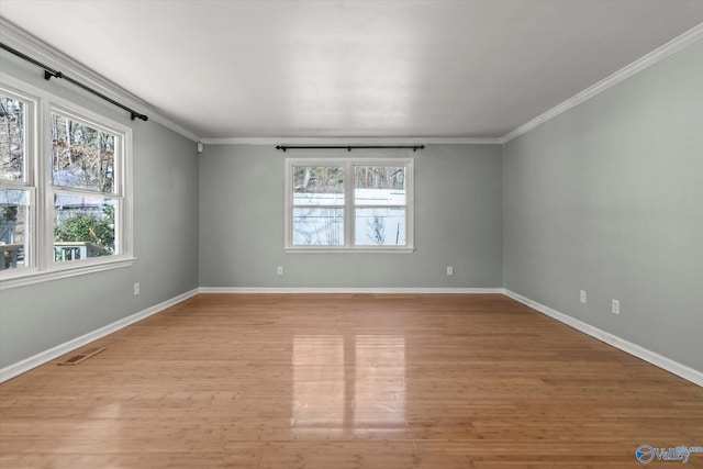839 Bow Range Rd, Guntersville, AL 35976 - unfurnished room with crown molding, visible vents, baseboards, and light wood-type flooring