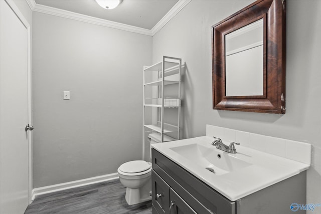 839 Bow Range Rd, Guntersville, AL 35976 - bathroom featuring baseboards, ornamental molding, toilet, vanity, and wood finished floors