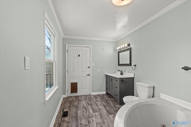 839 Bow Range Rd, Guntersville, AL 35976 - bathroom featuring baseboards, toilet, crown molding, a whirlpool tub, and vanity