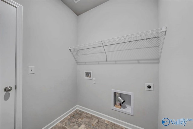 laundry area with hookup for an electric dryer, stone finish flooring, baseboards, laundry area, and washer hookup