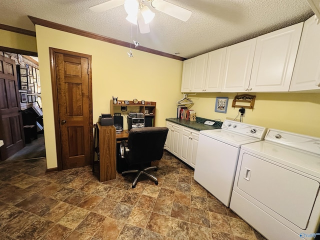 clothes washing area with cabinet space, ornamental molding, washing machine and dryer, ceiling fan, and a textured ceiling