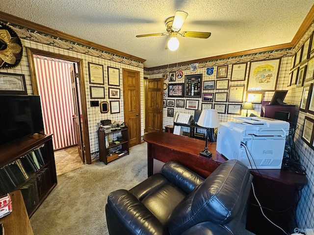 office area with wallpapered walls, a textured ceiling, crown molding, and light colored carpet