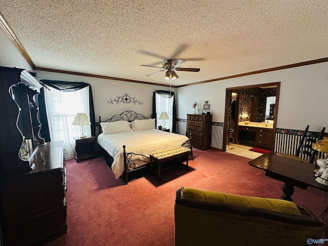 carpeted bedroom featuring ceiling fan, ornamental molding, a textured ceiling, and ensuite bathroom