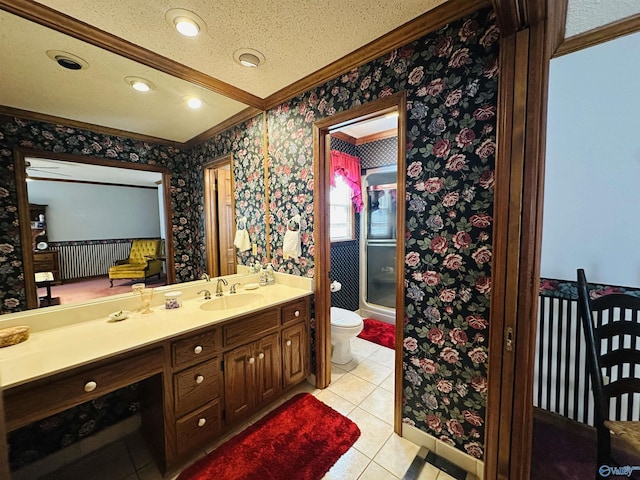 full bath featuring toilet, a shower with shower door, vanity, ornamental molding, and wallpapered walls