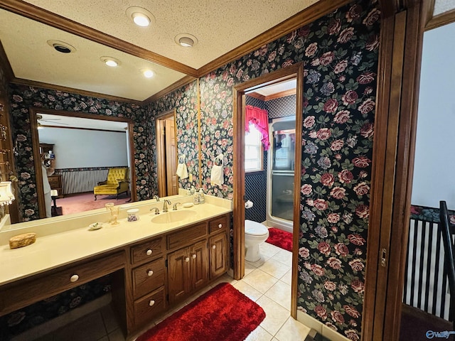 full bathroom featuring wallpapered walls, toilet, tile patterned floors, a shower with shower door, and vanity