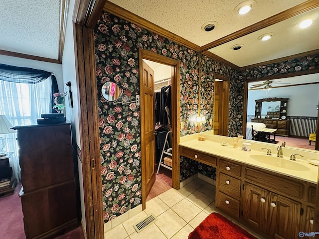 full bathroom with crown molding, visible vents, a textured ceiling, vanity, and wallpapered walls