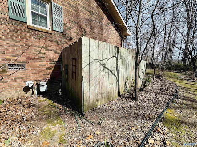 view of home's exterior with brick siding