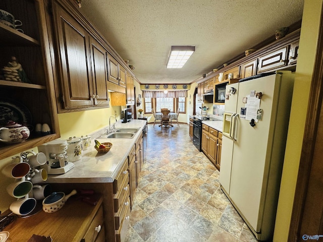 kitchen with black electric range oven, light countertops, white fridge with ice dispenser, open shelves, and a sink