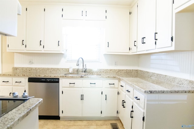 kitchen featuring dishwasher, white cabinetry, sink, and light stone countertops