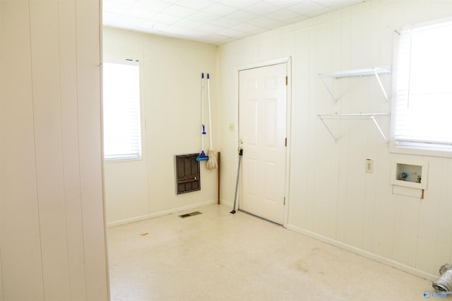 washroom with hookup for a washing machine and wooden walls