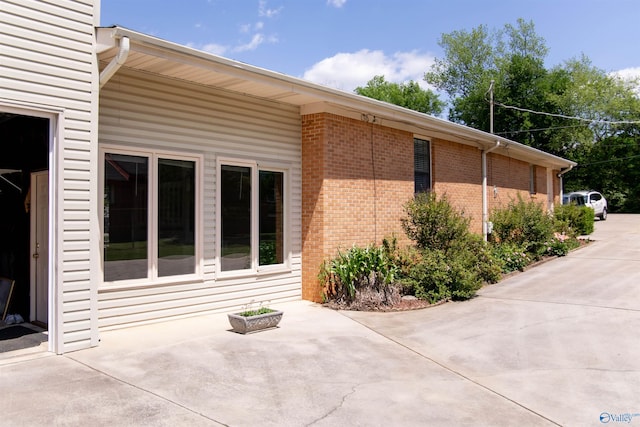 view of property exterior featuring a patio