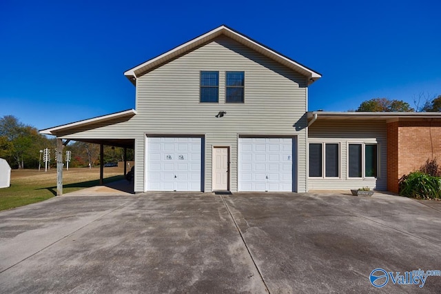 view of home's exterior with a garage and a carport