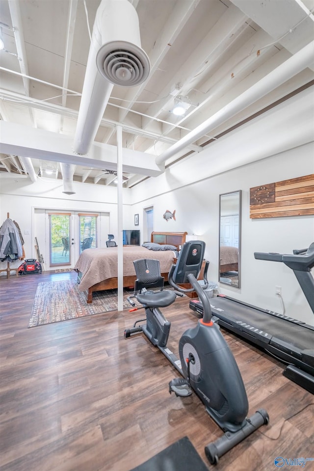 bedroom featuring wood finished floors and visible vents