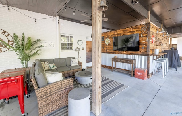 view of patio / terrace featuring exterior bar and an outdoor living space