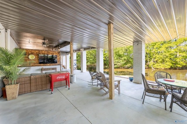 view of patio with ceiling fan and outdoor dining area