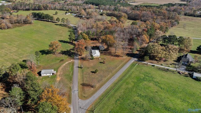 birds eye view of property featuring a rural view