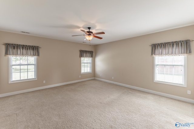 carpeted empty room with ceiling fan