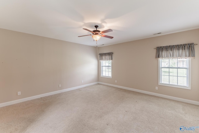 empty room with carpet flooring and ceiling fan