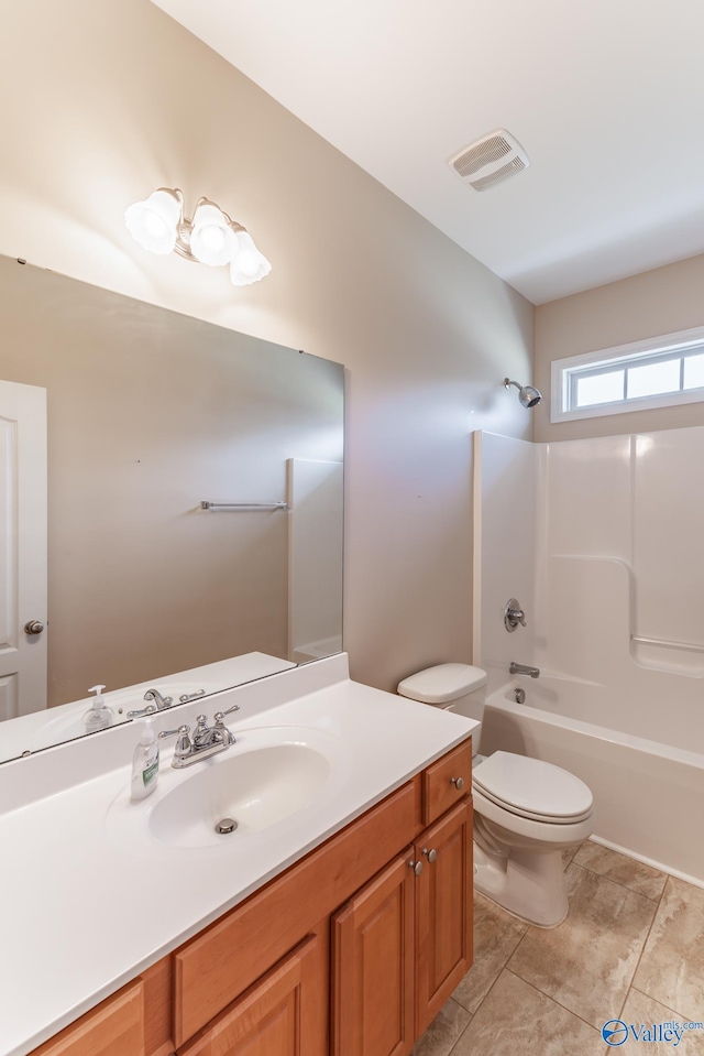 full bathroom featuring vanity, tile patterned flooring, toilet, and shower / bathtub combination