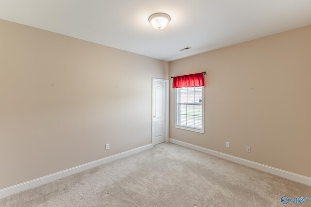 view of carpeted spare room