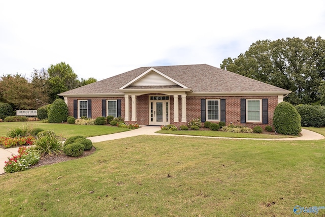 craftsman house featuring a front lawn and french doors