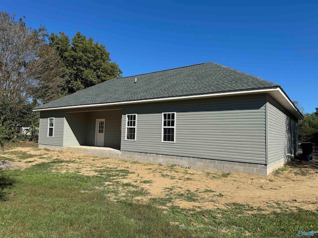 back of house featuring a patio area and a yard