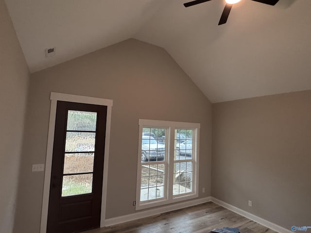 entrance foyer with light wood-type flooring, vaulted ceiling, and ceiling fan